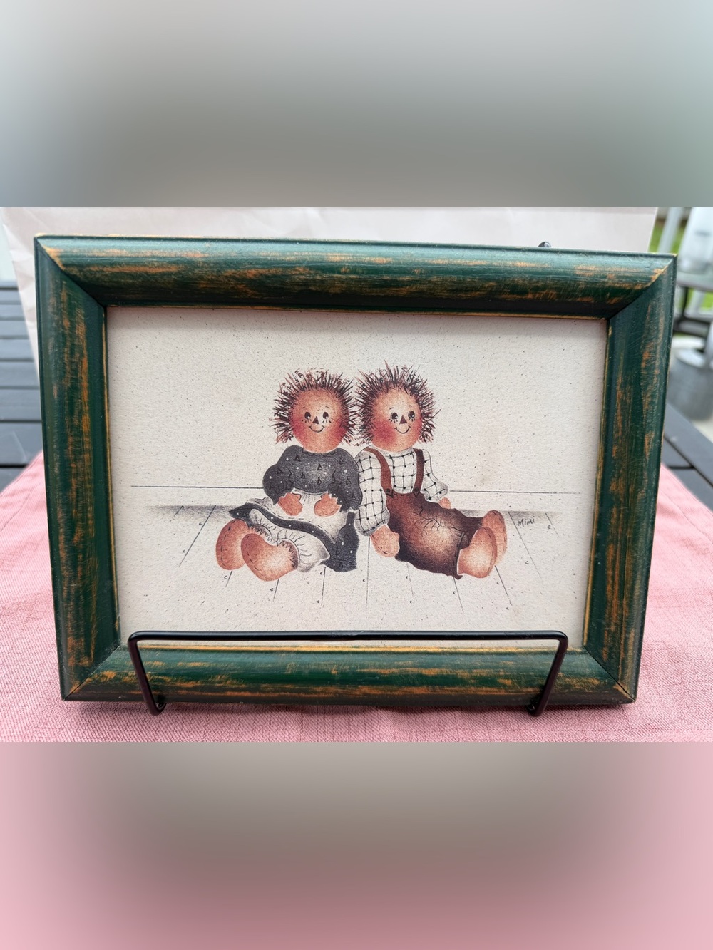 Whimsical Rag Doll Sitter Artwork with Green Frame